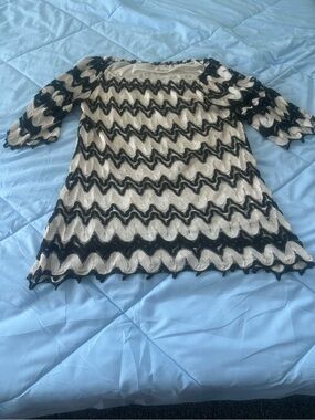 Size Large Lady’s World Black and cream chevron lace dress with bell sleeves.
